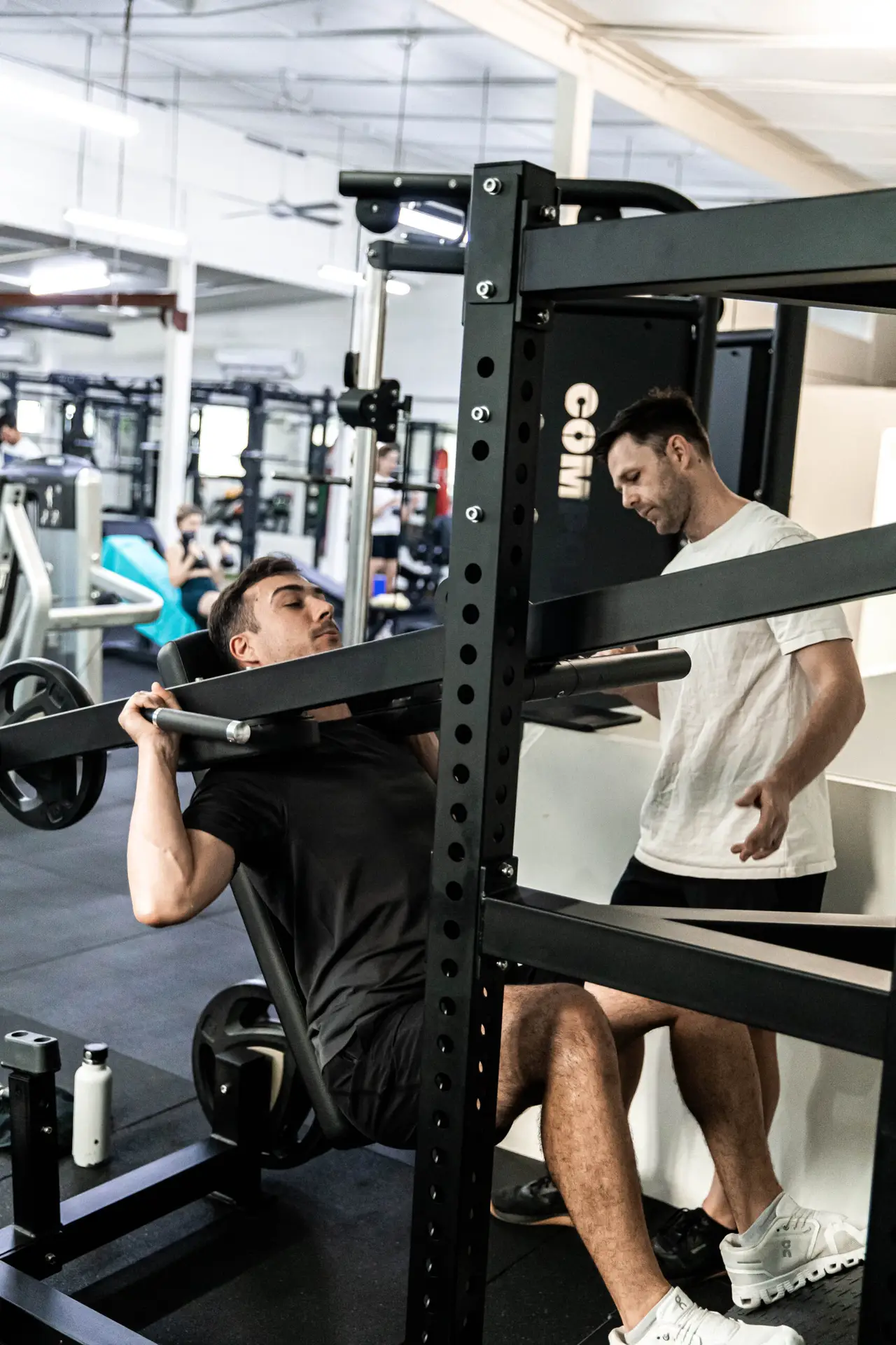 Focused personal training client lifting weights at Catalyst Training Co Randwick gym