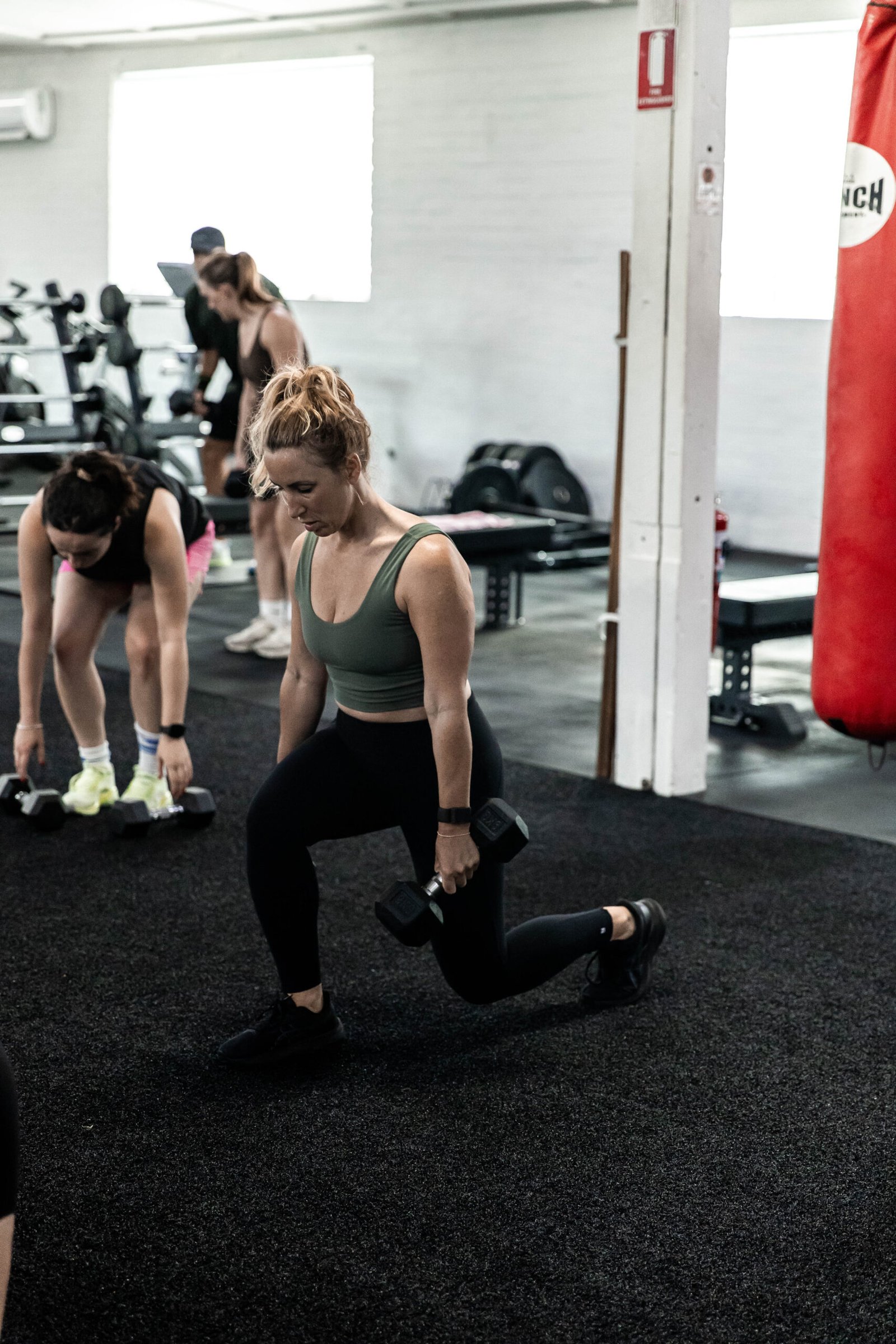 Catalyst coach guiding a member through training