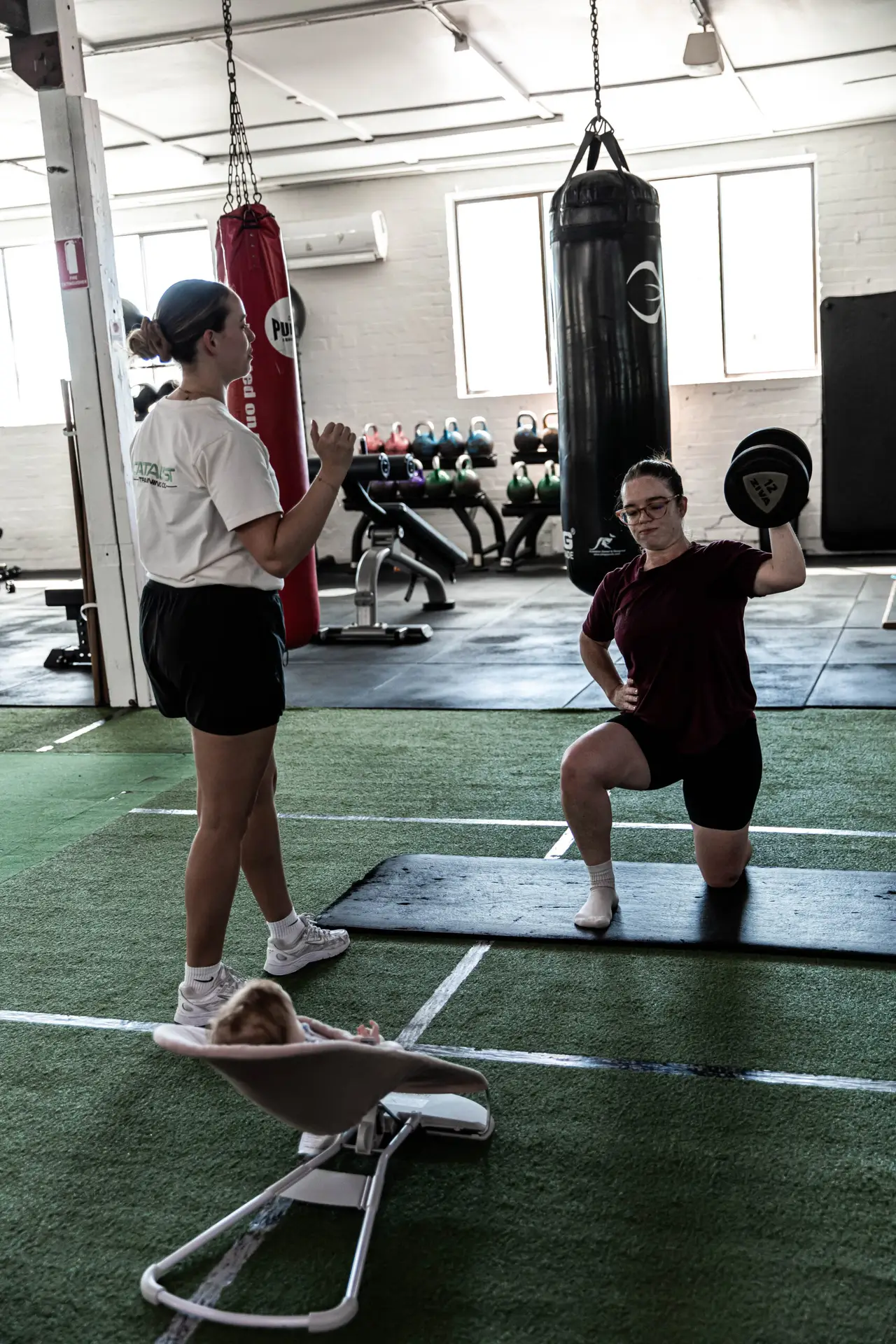 Woman performing strength training exercise at Catalyst Training Co gym Randwick