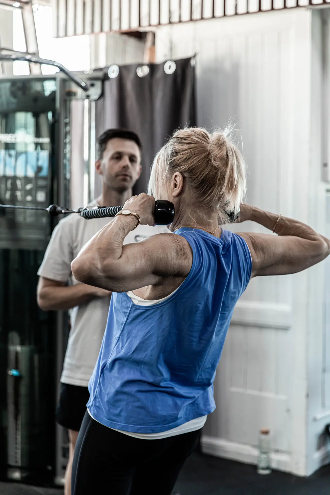 Coach watching a member through a cable exercise at Catalyst Training Co Randwick