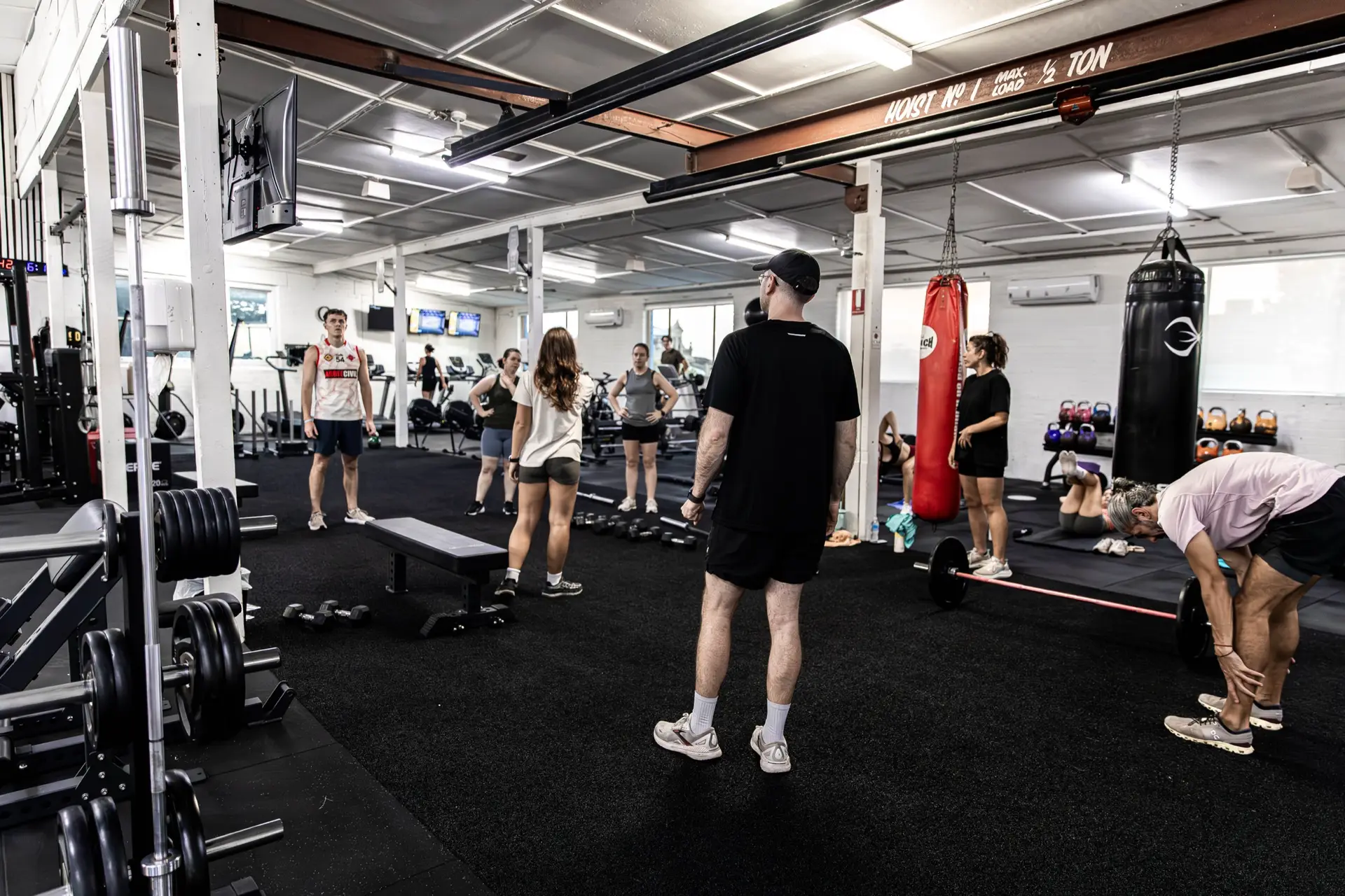 Coached group functional fitness class on the turf floor at Catalyst Training Co Randwick