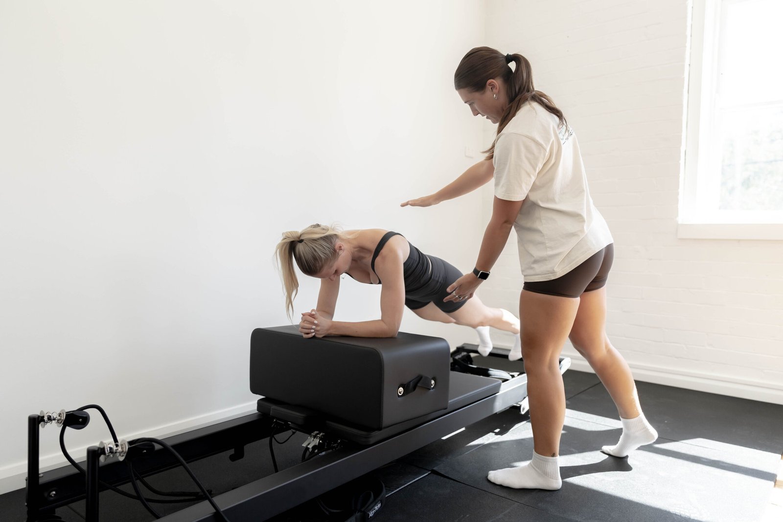 Coach guiding reformer Pilates at Catalyst Randwick