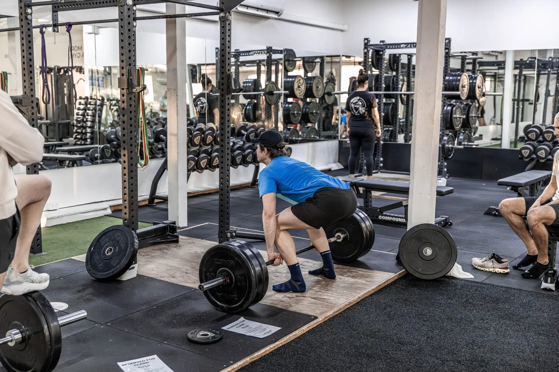 A member setting up a deadlift on the platform during open gym at Catalyst Training Co Randwick