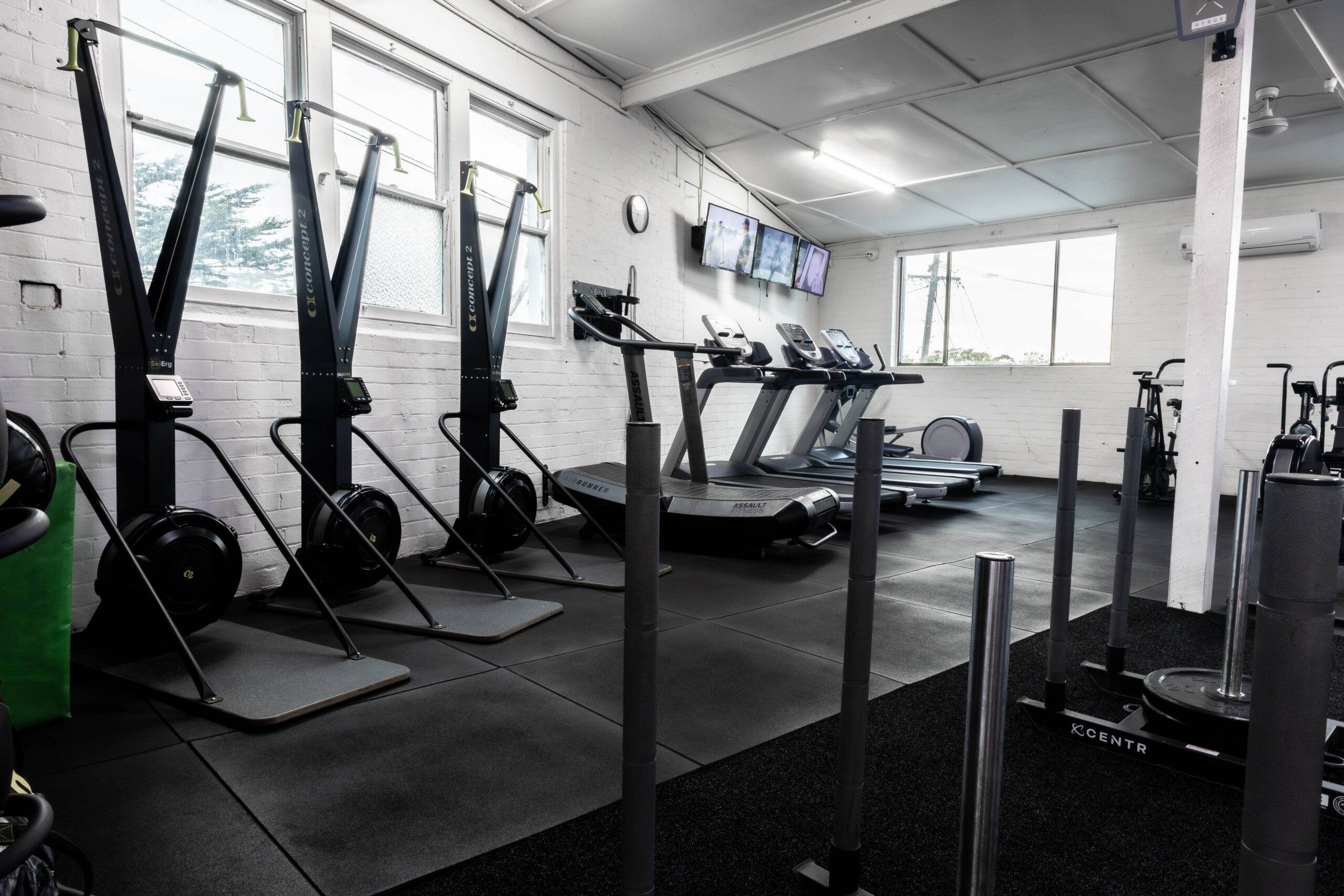 Concept2 SkiErgs, treadmills and weight sleds in the conditioning zone at Catalyst Training Co Randwick