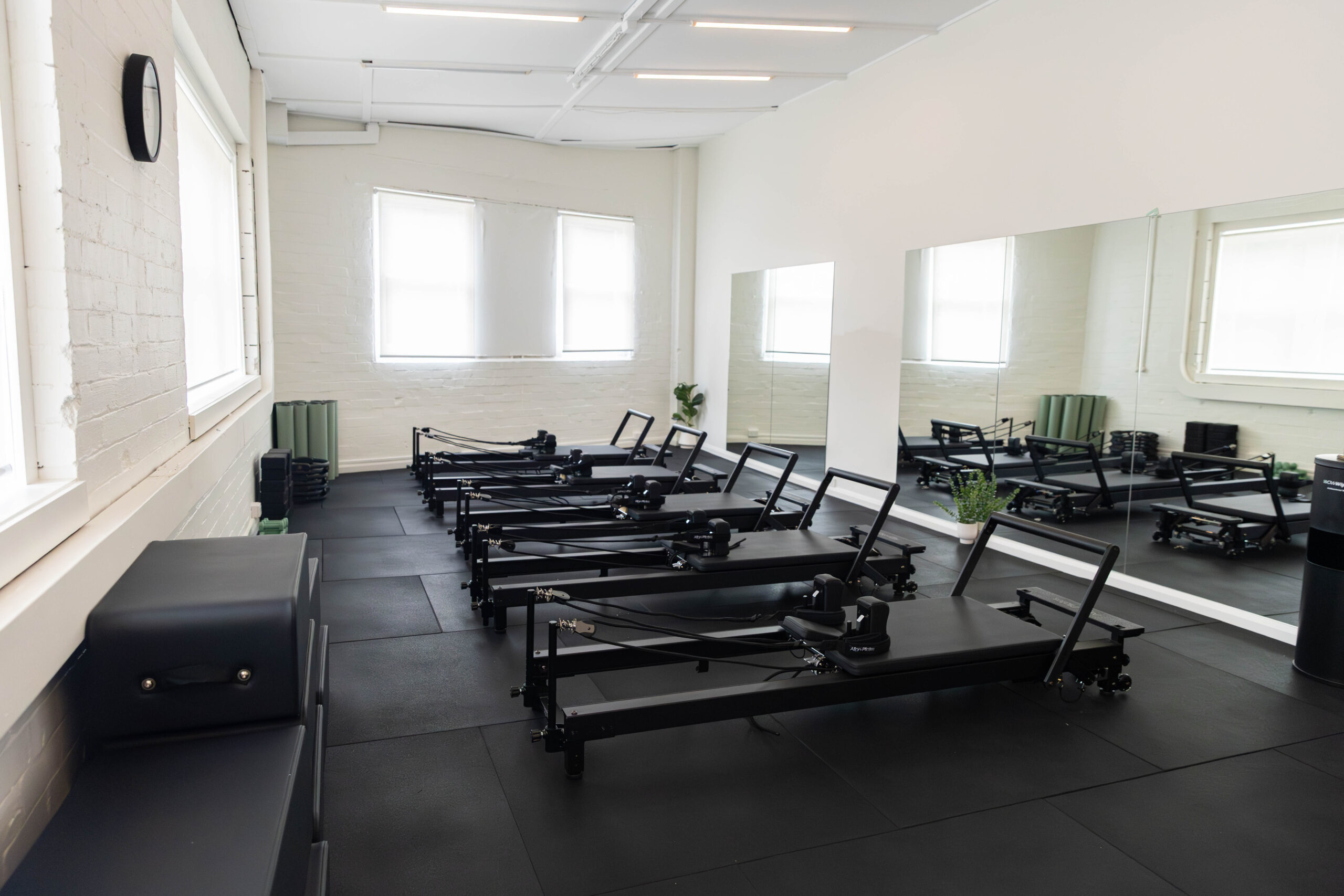 The reformer Pilates studio at Catalyst Training Co Randwick, a separate mirrored room with natural light