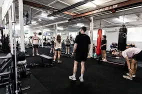 Coached group functional fitness class on the turf floor at Catalyst Training Co Randwick